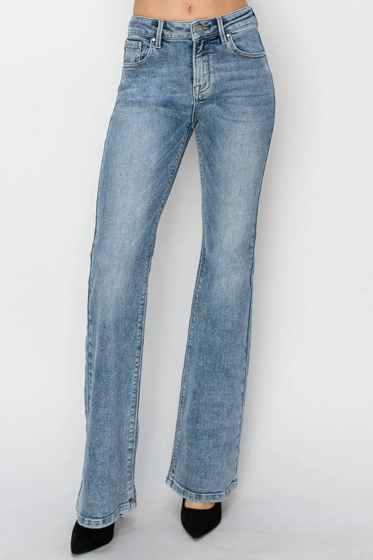 Full size mid-rise bootcut jeans by RISEN, styled on a model, showcasing classic denim fit and dark wash.