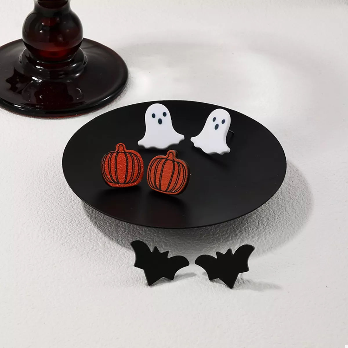 Three Halloween-themed stud earrings featuring spooky designs, perfect for festive accessories and costume jewelry.
