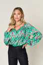 Printed balloon sleeve blouse from Trendsi featuring a double take full-size design and stylish balloon sleeves.