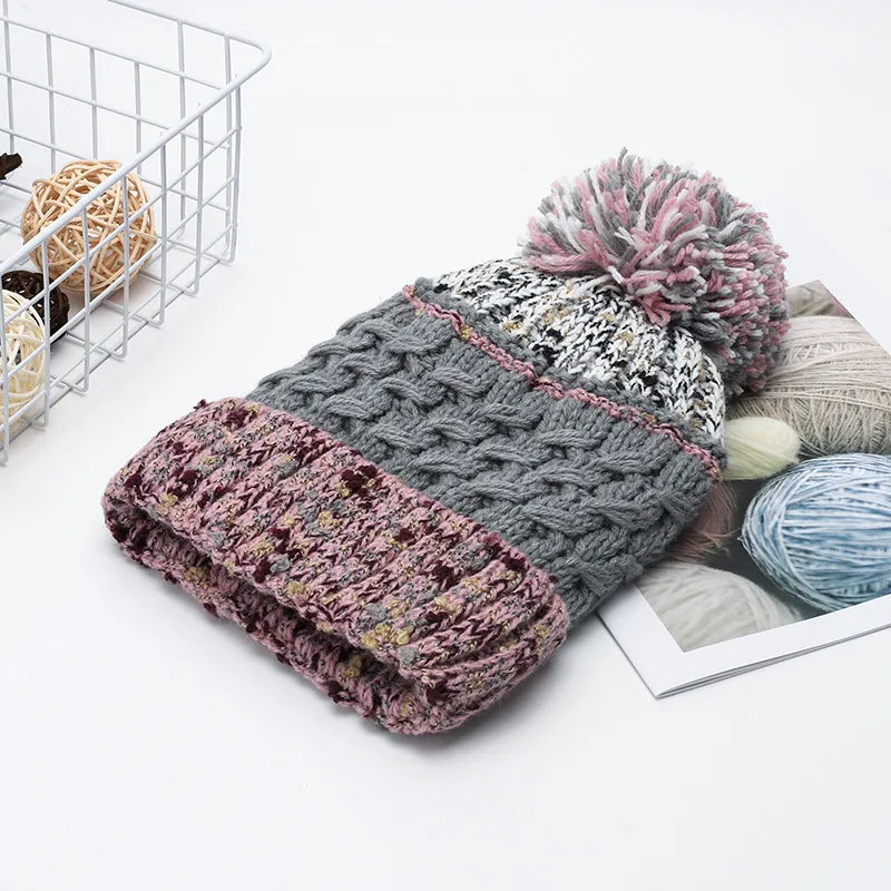 Contrast thermal hat with pompom by Trendsi featuring a cozy, knitted design and playful pompom on top for winter warmth.
