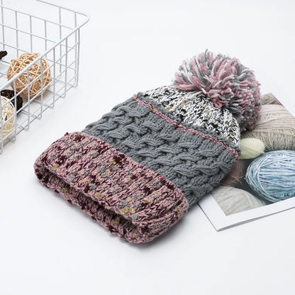 Contrast thermal hat with pompom by Trendsi featuring a cozy, knitted design and playful pompom on top for winter warmth.
