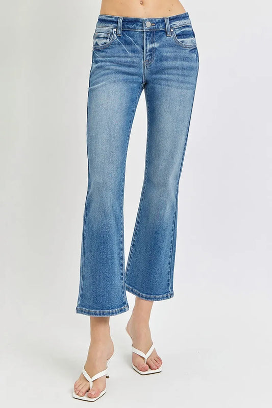 Plus size RISEN low rise crop flare jeans by Trendsi, showing fit and style with a focus on the denim and flare design.