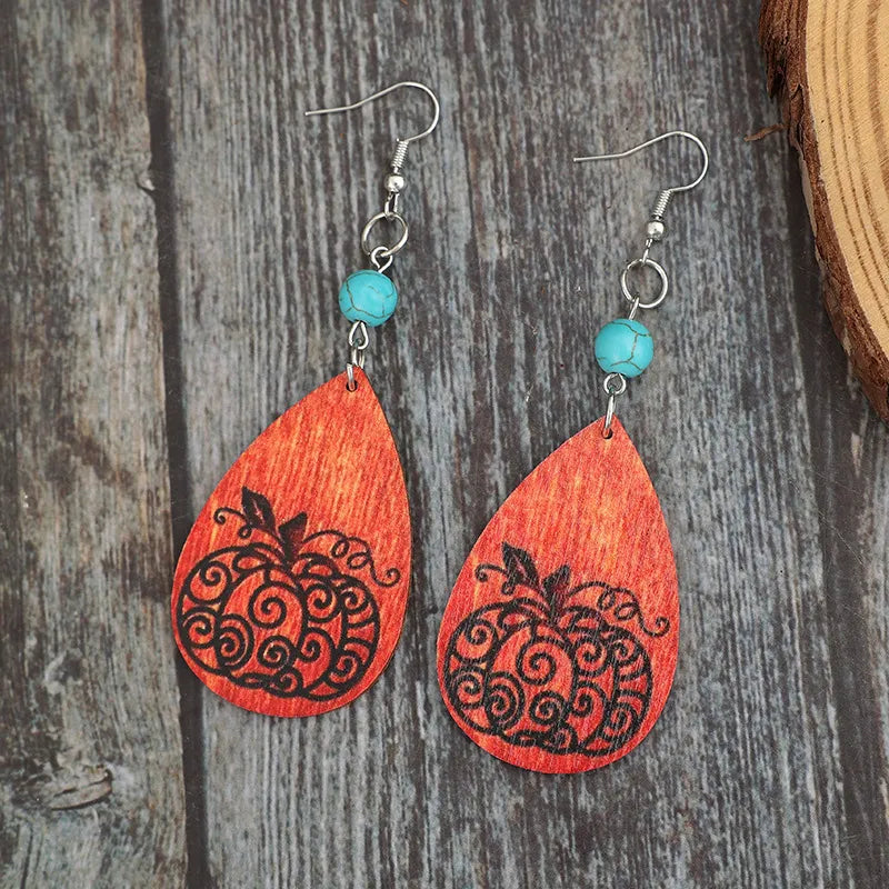 Turquoise wooden pumpkin teardrop earrings with carved pumpkin design and teardrop shape, stylish jewelry from Trendsi.