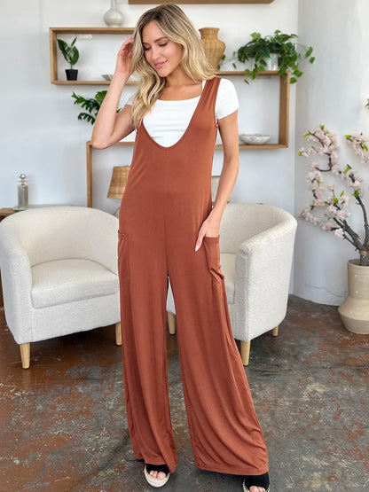 Plus size Trendsi double take sleeveless wide-leg jumpsuit with pockets, full-length, casual, and comfortable for summer wear.