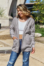 Full size Teddy hooded jacket with pockets by Trendsi, featuring soft faux fur material and a cozy, casual fit.