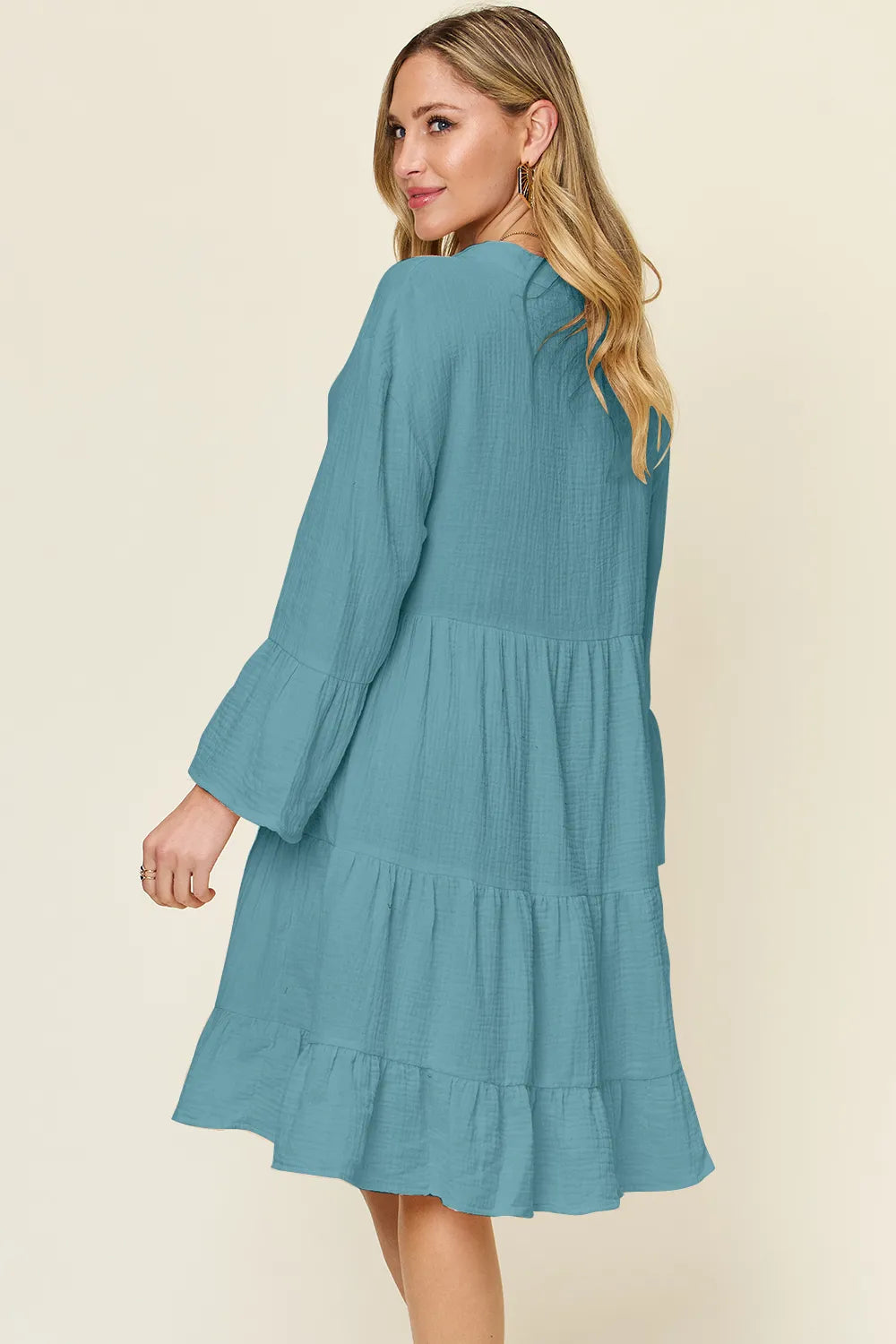 Plus size Trendsi Double Take full size texture button-up dress with ruffle hem, showcasing its stylish design and fabric details.