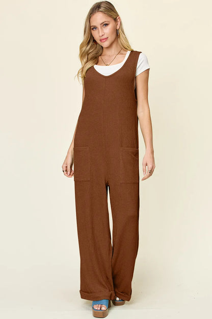 Trendsi Double Take full-size sleeveless jumpsuit with textured fabric, wide-leg design, and sleeveless style, shown on a model.