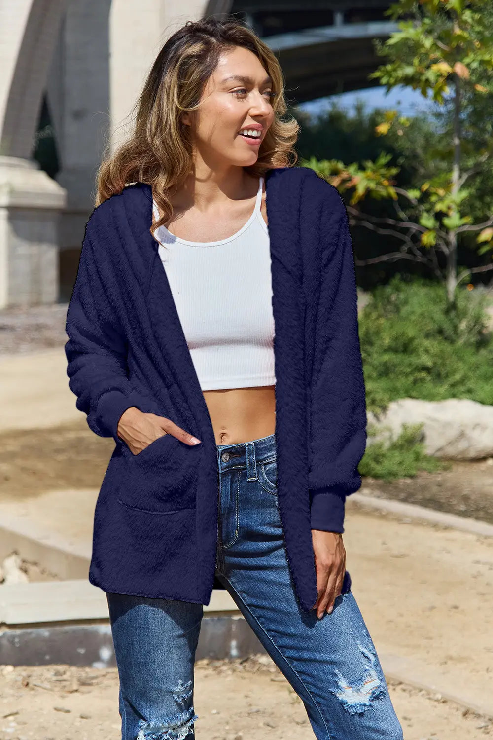 Full size teddy hooded jacket with pockets from Trendsi, soft plush fabric, featuring a cozy hood and practical front pockets.