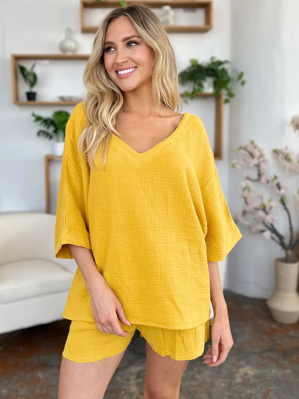 Trendsi Double Take Texture half sleeve T-shirt and drawstring shorts set shown in a casual outfit with a textured fabric design.