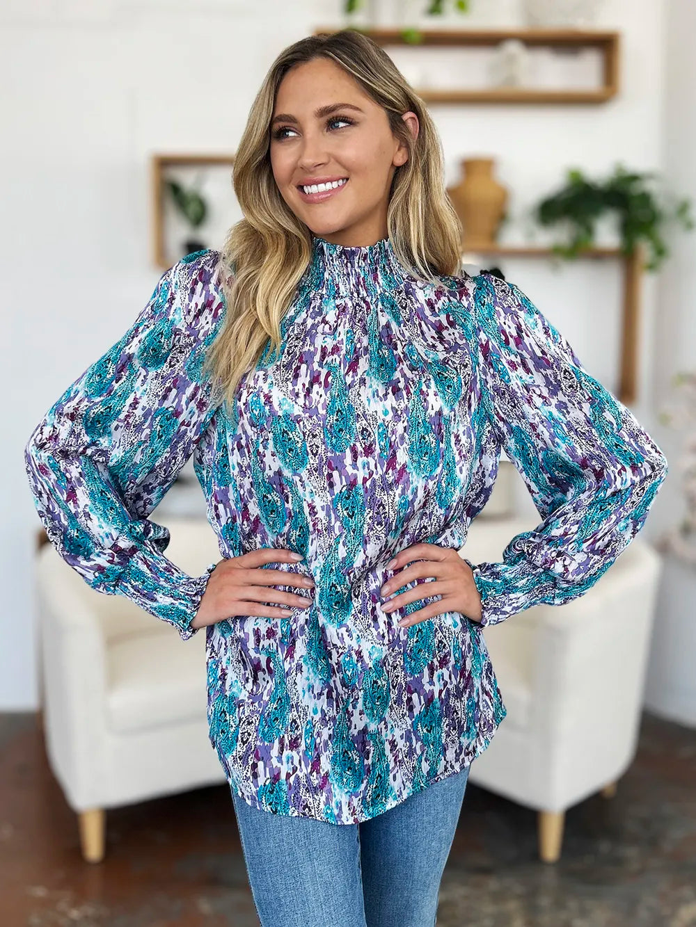 Printed smocked long sleeve blouse from Trendsi, featuring a double take full size design with a stylish, gathered neckline and relaxed fit.