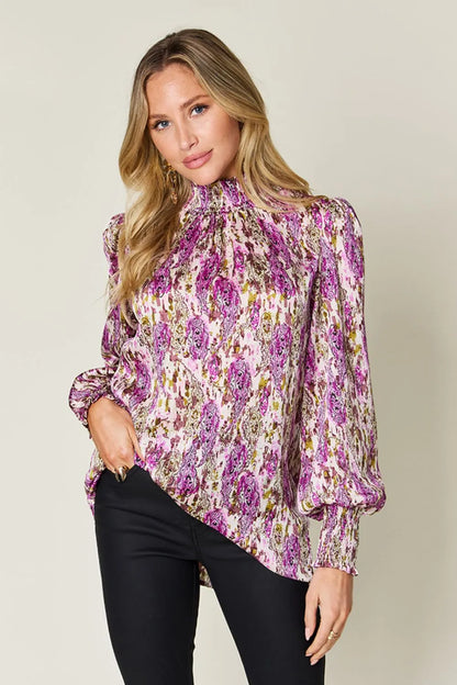 Printed smocked long sleeve blouse from Trendsi featuring a double take full size design with colorful patterns.