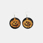 Trendsi PU leather pumpkin earrings featuring orange pumpkin-shaped charms with gold-tone accents, perfect for fall accessories.