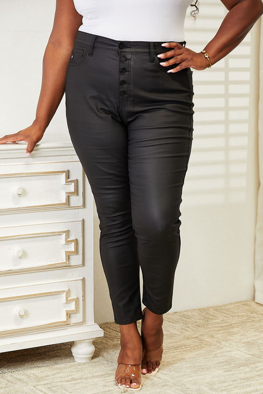 Black coated ankle skinny jeans by Kancan, high-rise, full size, trendy fitted denim pants shown on model.