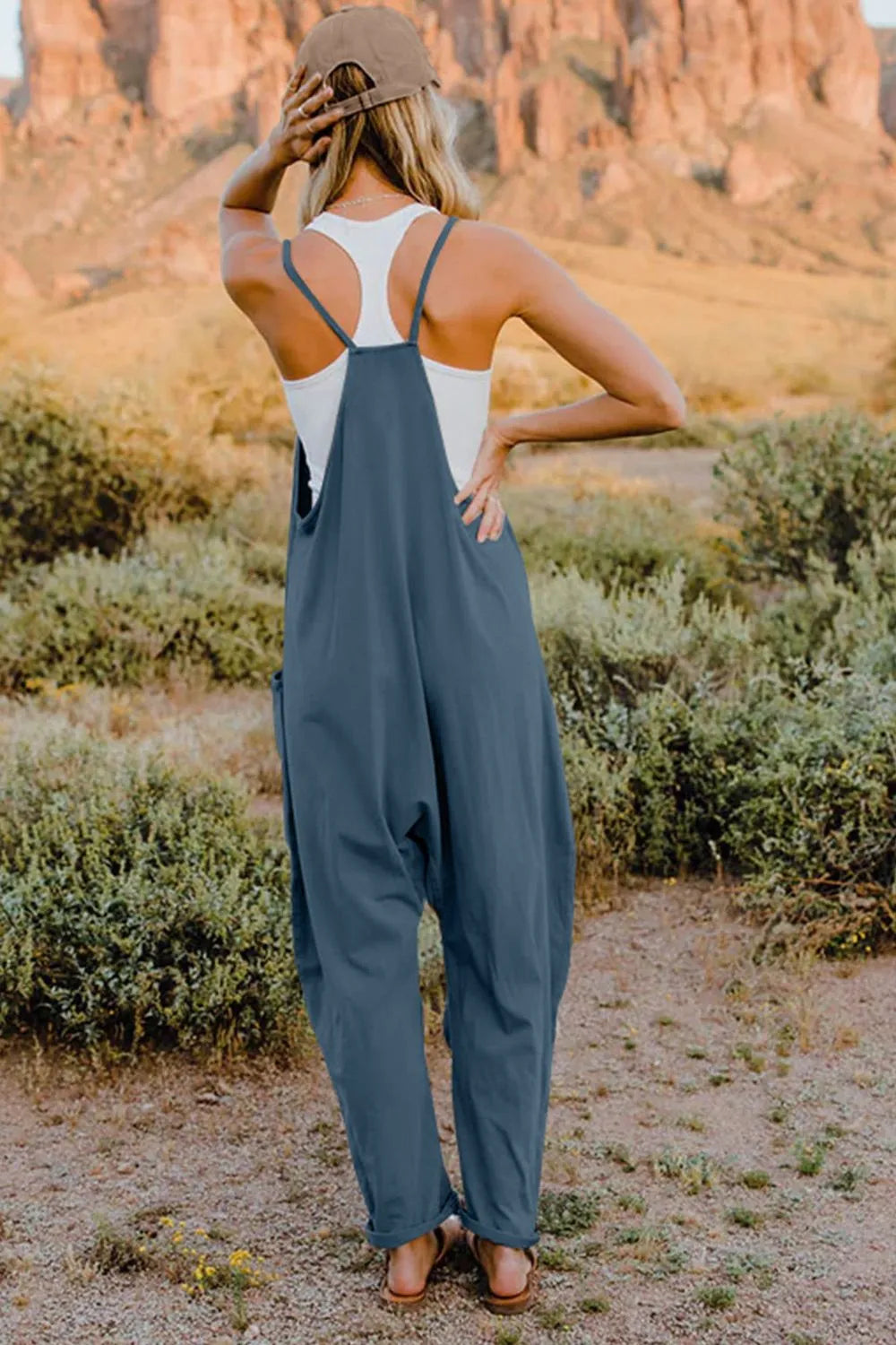 Trendsi Double Take full size sleeveless V-neck jumpsuit with pockets, showcasing its stylish design and comfortable fit.