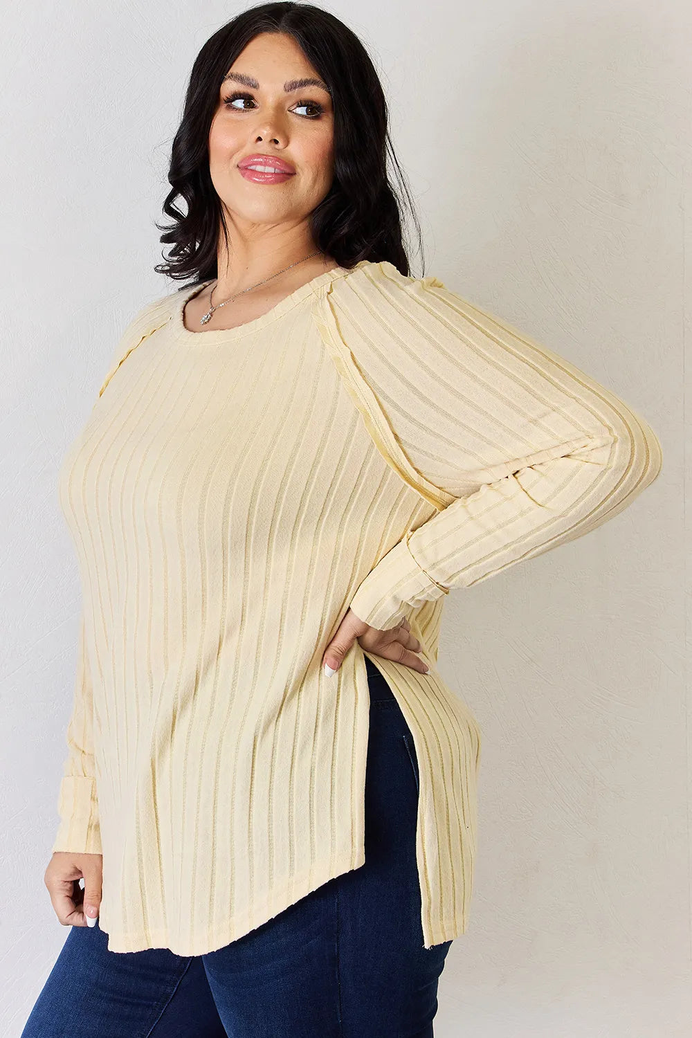 Basic Bae full-size ribbed round neck slit T-shirt from Trendsi, shown in black with ribbed fabric and a relaxed fit.