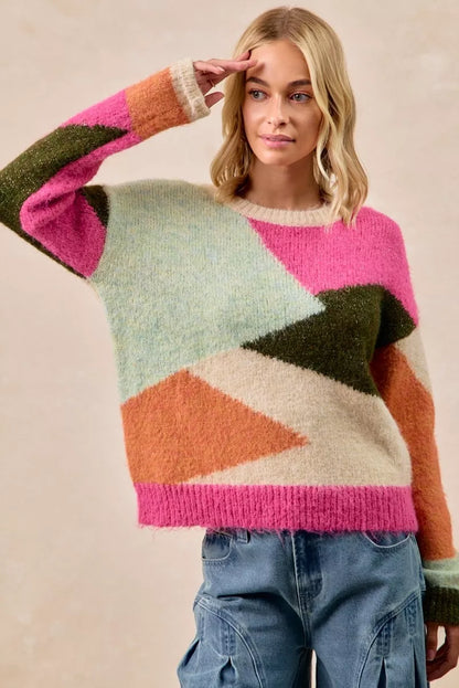 Multi-color block sweater top by Trendsi featuring a cozy knit design and vibrant color blocks.