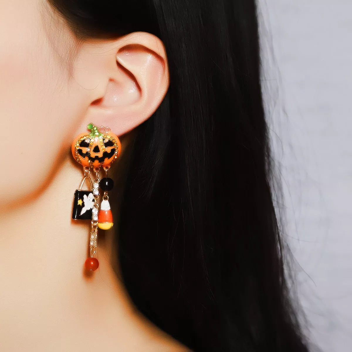 Halloween pumpkin ghost dangle earrings featuring spooky pumpkin and ghost charms, perfect for Halloween accessories.