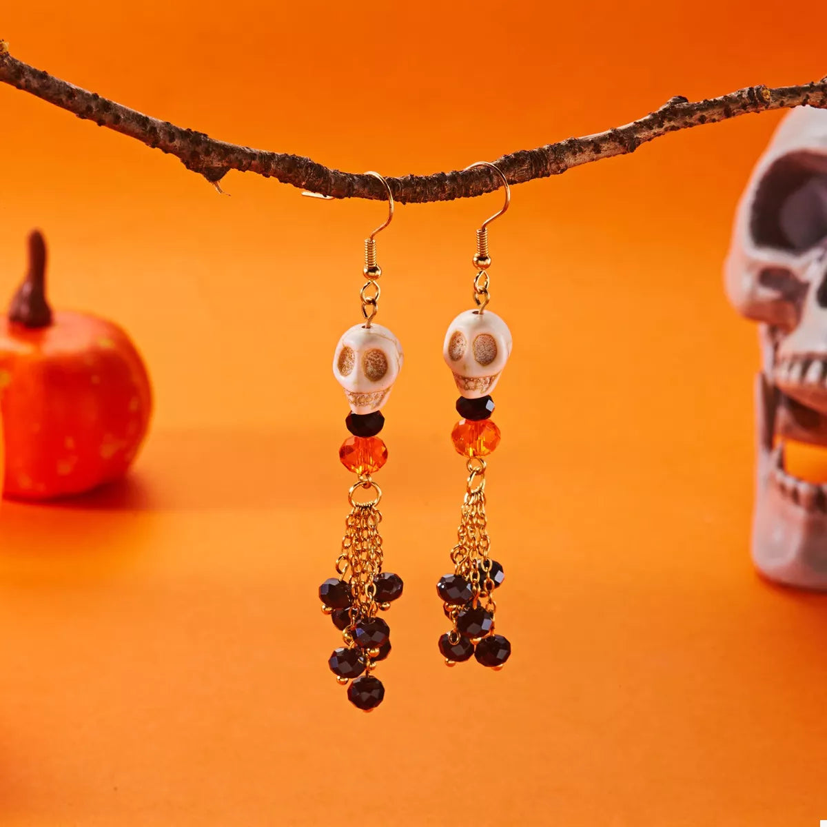 Halloween Skull Beaded Drop Earrings featuring black beads and silver-tone skull charms, stylish jewelry for spooky occasions.