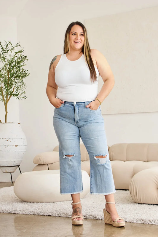 Trendsi RFM full size high waist distressed jeans with tummy control, raw hem, and raw hem, showcasing fit and fashionable design.