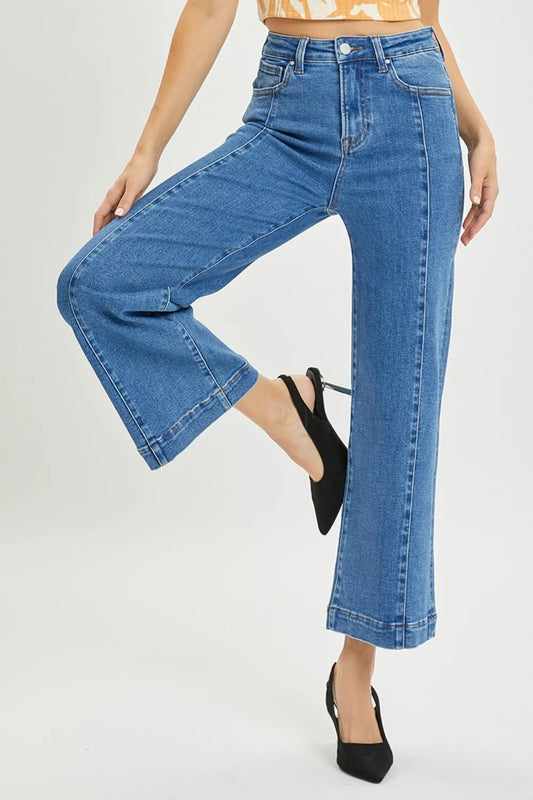 Risen full size high rise wide leg jeans by Trendsi, featuring a classic denim look and relaxed fit, styled on a model.