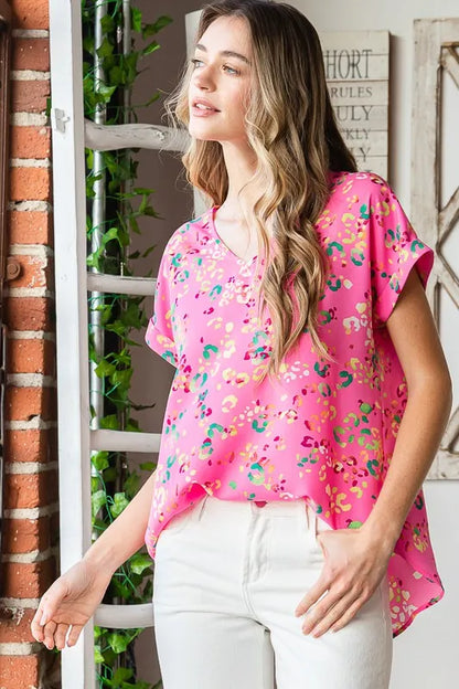 Heimish full-size animal print V-neck short sleeve T-shirt in plus size, featuring a stylish and comfortable design.