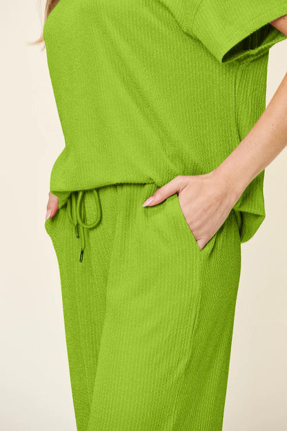 Trendsi Double Take full size textured round neck short sleeve T-shirt and wide-leg pants, casual comfortable outfit.