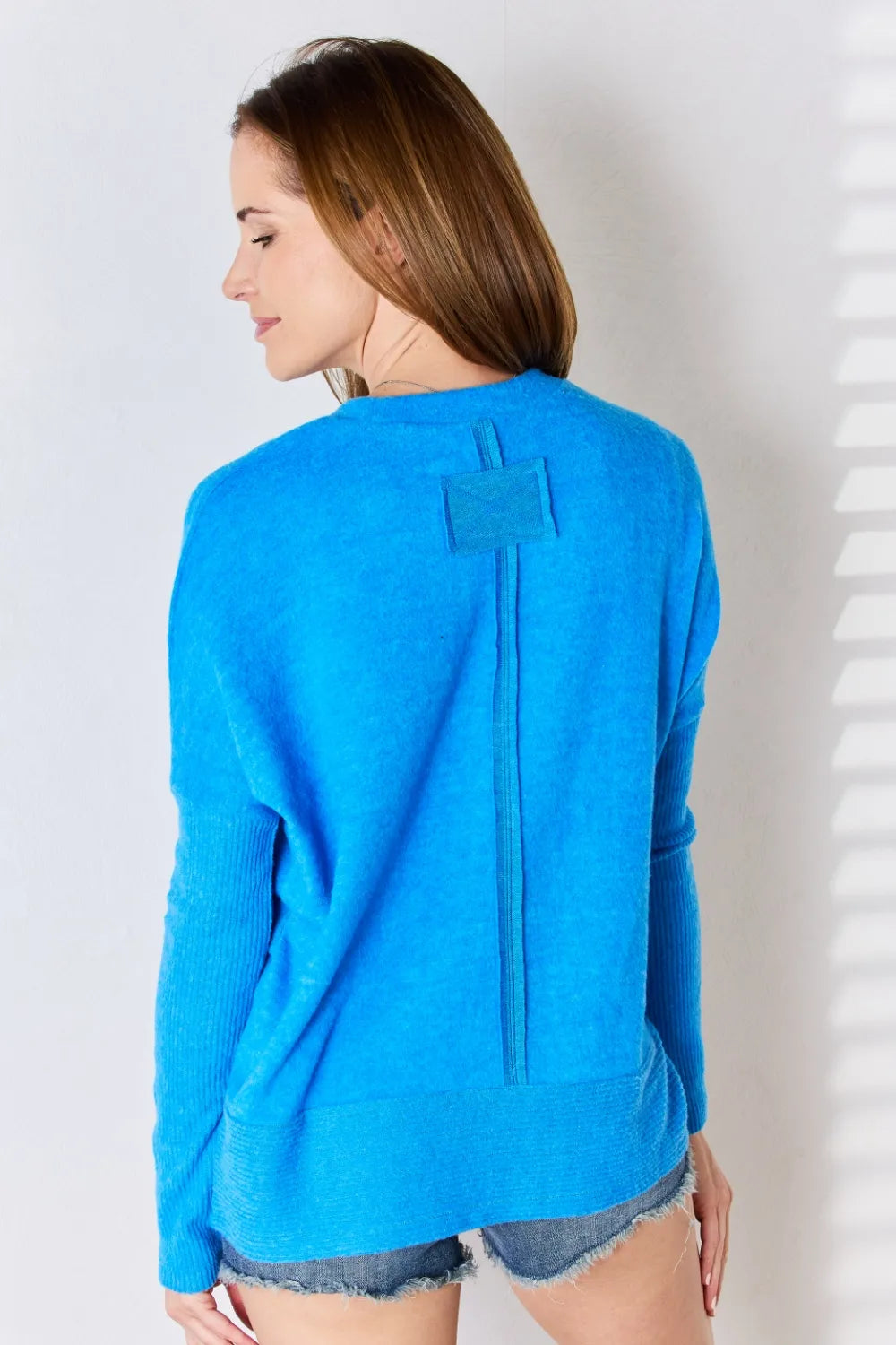 Zenana ribbed trim round neck long sleeve top in a neutral color, showcasing the close-fitting design and ribbed detailing.