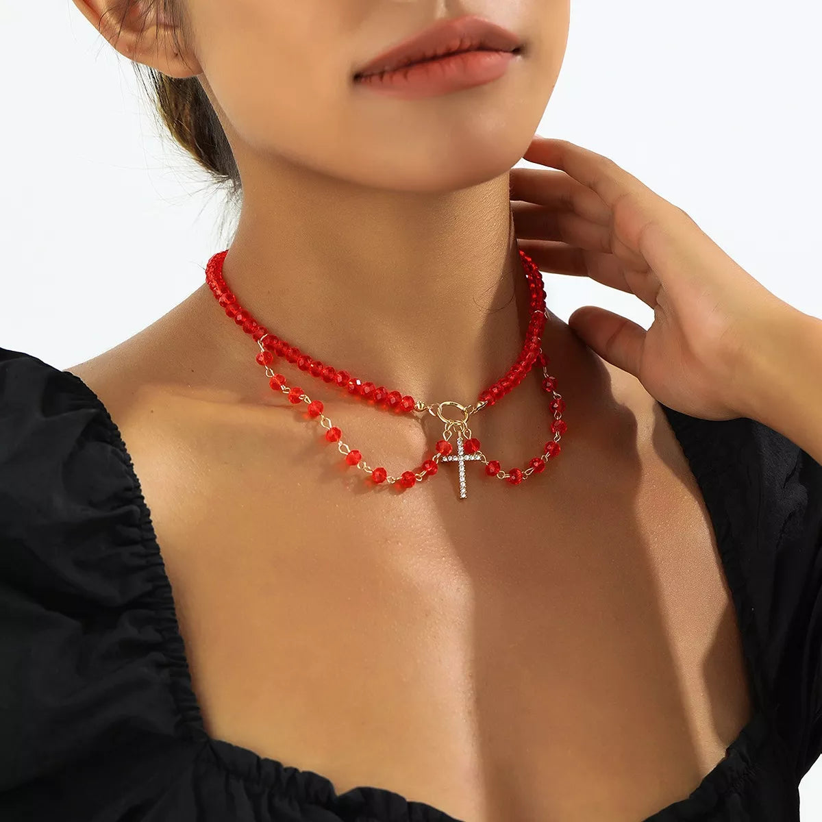 Halloween beaded cross pendant necklace with black and orange beads, featuring a silver cross charm, perfect for spooky seasonal style.