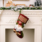 Decorative Christmas stocking hanging widget from Trendsi, featuring festive design and hanging loop for holiday decor.