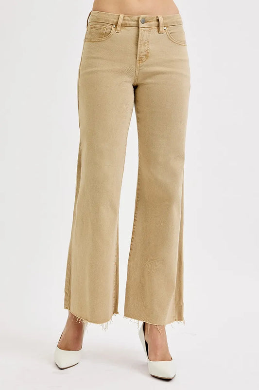 Plus size RISEN raw hem wide leg jeans from Trendsi, showing the full-length raw hem design and relaxed fit in denim fabric.