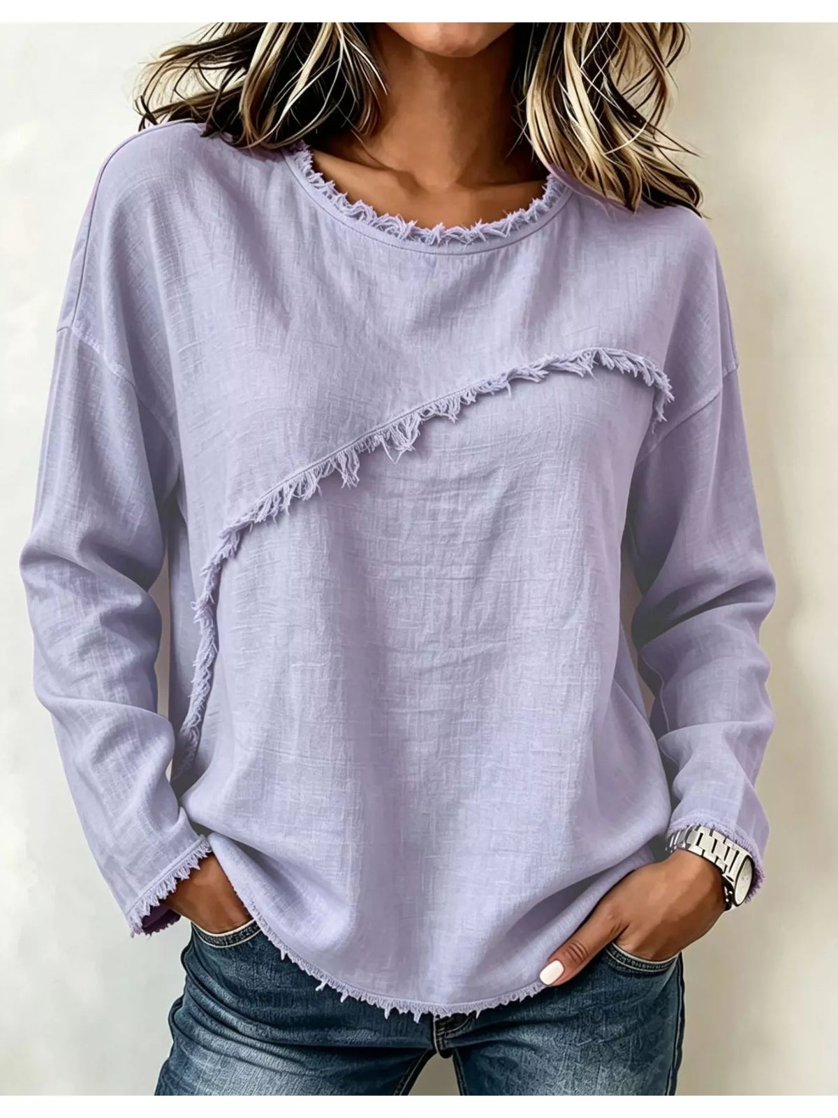 Frayed hem dropped shoulder blouse by Trendsi featuring lightweight fabric and relaxed fit, displayed on a hanger.