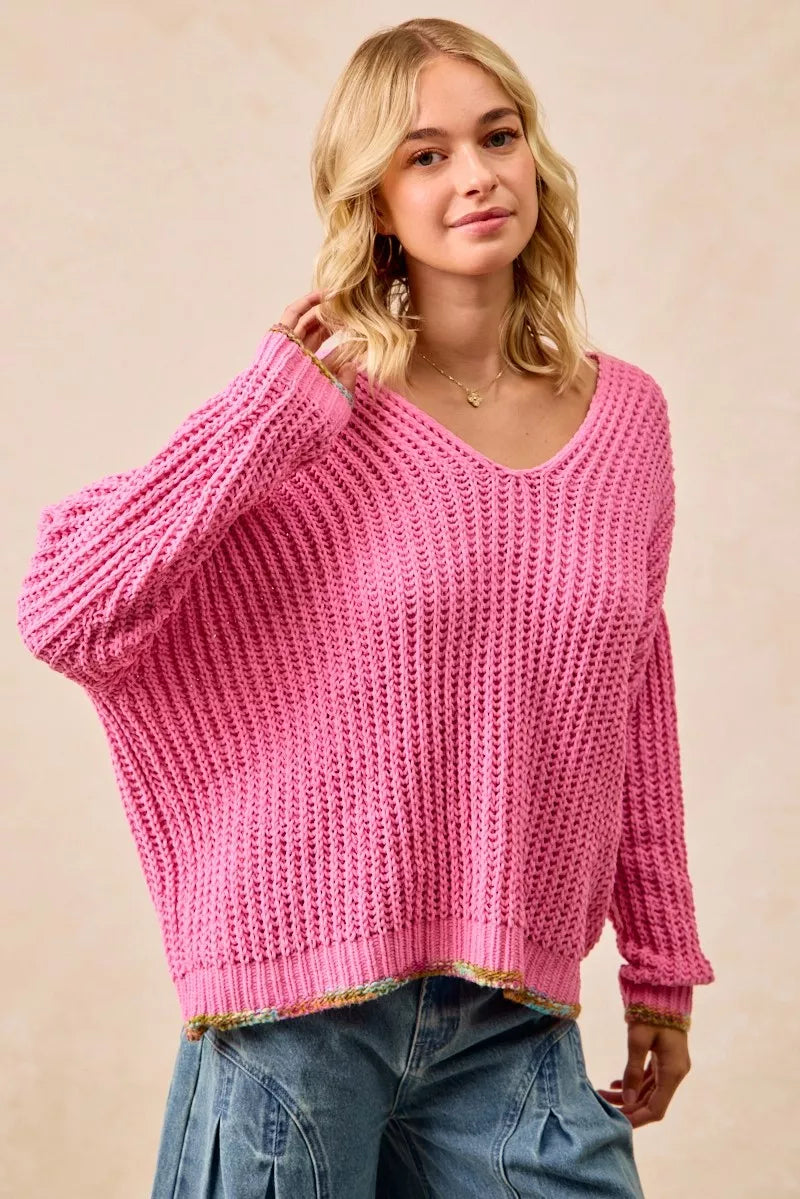 BiBi V-neck sweater by Trendsi featuring colorful trim and soft knit fabric, displayed on a mannequin.