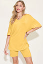 Basic Bae bamboo full-size V-neck drop shoulder T-shirt and shorts set by Trendsi, shown in natural fabric detail and relaxed fit.