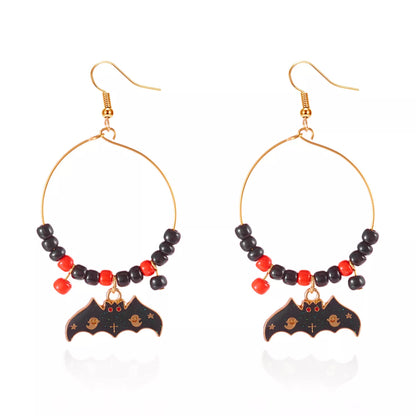 Halloween Bat Charm Hoop Earrings featuring black bat charms on silver hoops, stylish and spooky accessory.
