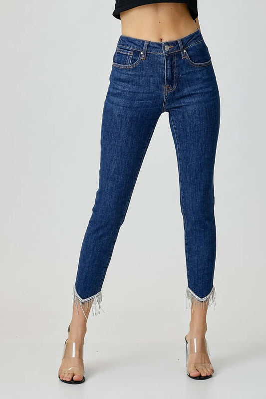 Risen full size embellished mid-rise crop skinny jeans with decorative details, stylish denim by Trendsi, shown in natural light.