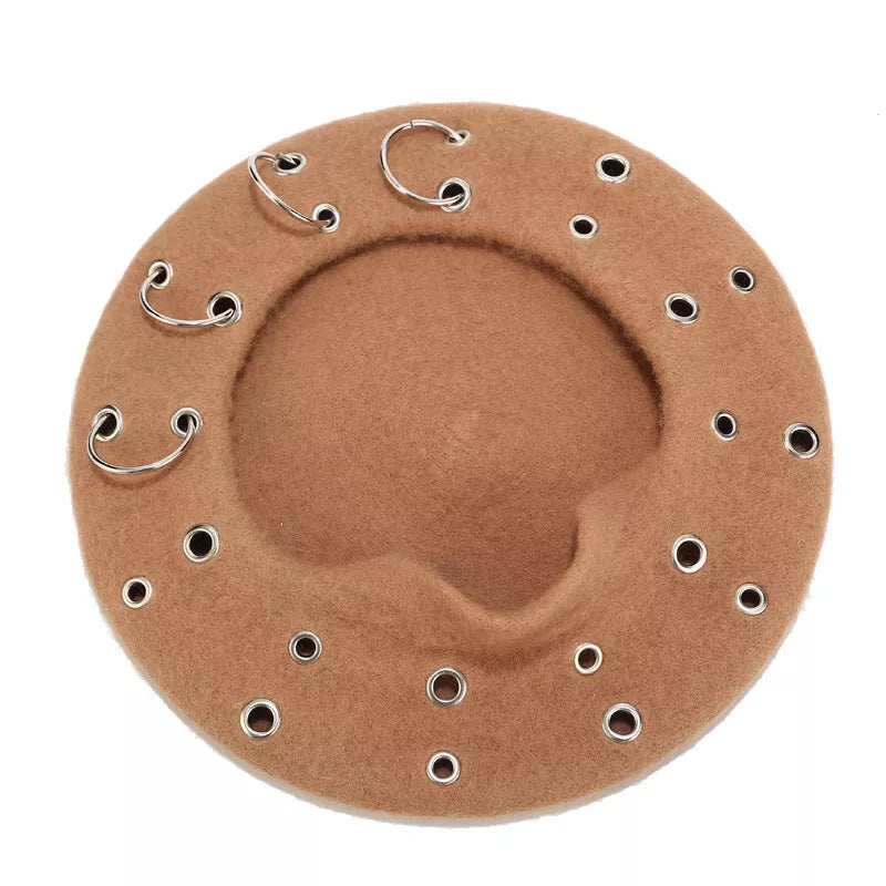 Metal ring embellished beret hat by Trendsi featuring a classic black wool fabric with stylish metal ring accents.