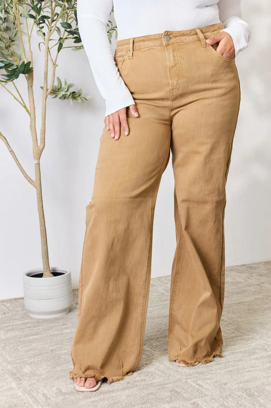 Risen full size fringe hem wide leg jeans with distressed details, styled with a relaxed fit and trendy design.