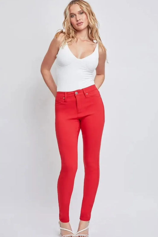 YMI Jeanswear full size hyperstretch mid-rise skinny jeans in dark wash, showcasing a close-up of the fitted denim fabric and waistband.