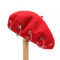 Metal ring embellished beret hat by Trendsi featuring a classic black fabric with stylish metal ring accents.