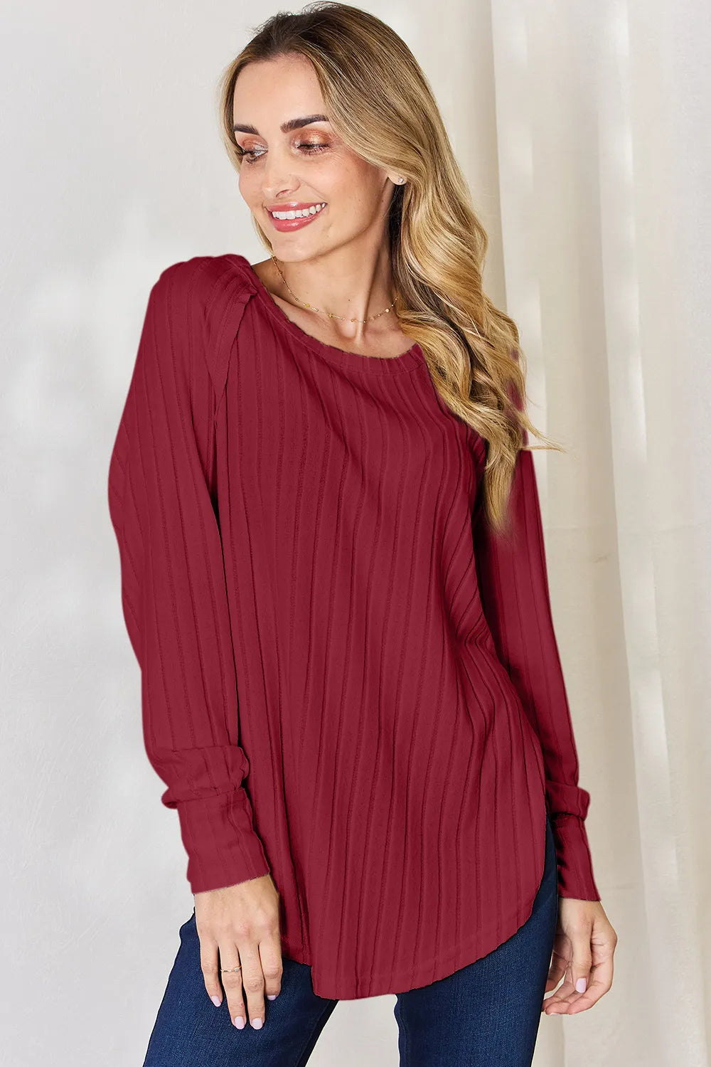 Basic Bae full-size ribbed round neck slit T-shirt from Trendsi, featuring a ribbed texture and a stylish slit detail.