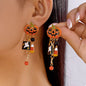 Halloween pumpkin drop earrings featuring orange pumpkin charms with black detailing, stylish jewelry by Trendsi.
