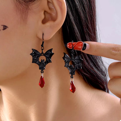 Gothic bat drop earrings with black bat-shaped design and dangling chain details, stylish jewelry by Trendsi