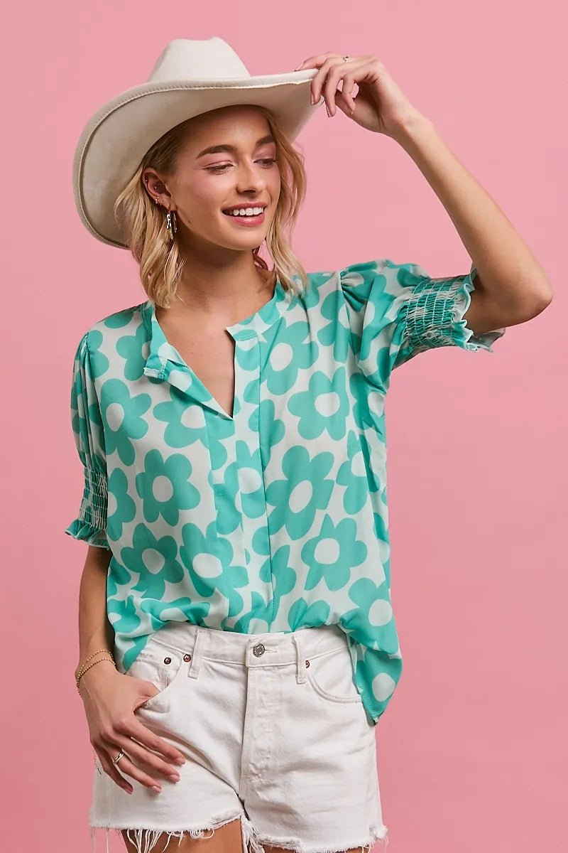 BiBi flower printed woven smocking sleeve V-neck top by Trendsi, featuring floral design and lightweight fabric.