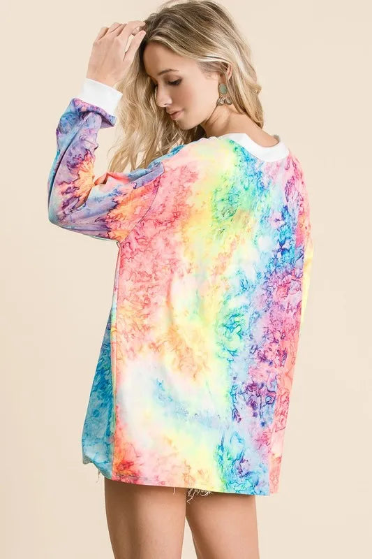 BiBi tie dye deep V-neck top from Trendsi with lace-up front, featuring vibrant colors and casual style.