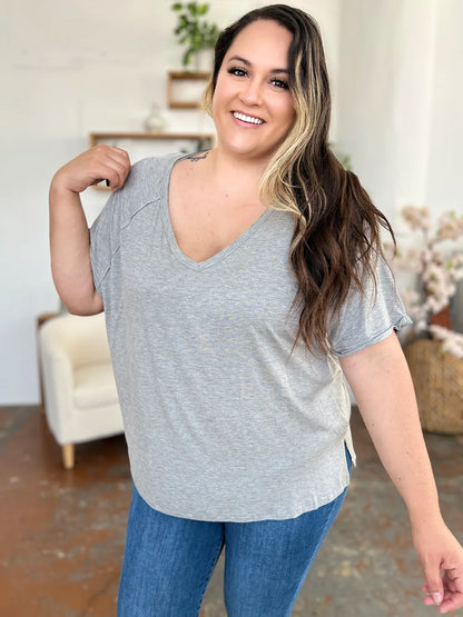 Basic Bae bamboo V-neck short sleeve T-shirt by Trendsi, featuring a slit design and lightweight, breathable fabric in natural bamboo color.