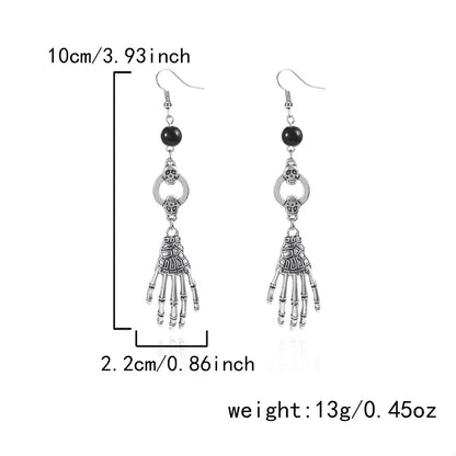 Halloween skeleton hand drop earrings with detailed bone design, stylish jewelry by Trendsi for spooky seasonal fashion.