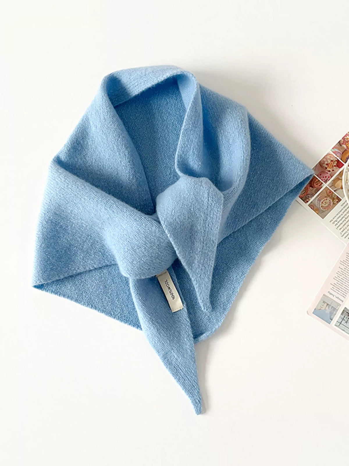 Solid color knit scarf from Trendsi, featuring a soft, cozy fabric in a versatile design perfect for winter accessories.