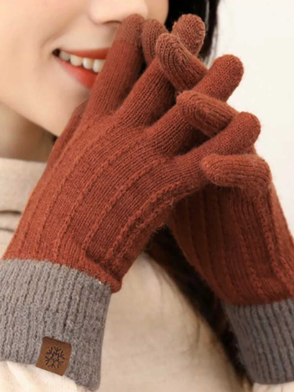 Warm knitted touchscreen gloves by Trendsi featuring cozy fabric and fingertip compatibility for use with smartphones.