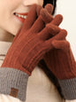 Warm knitted touchscreen gloves by Trendsi featuring cozy fabric and fingertip compatibility for use with smartphones.