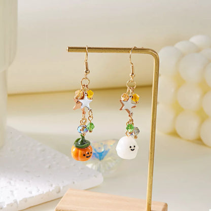 Halloween asymmetrical pumpkin and ghost earrings by Trendsi, featuring spooky orange pumpkin and ghost charms on dangle earrings.